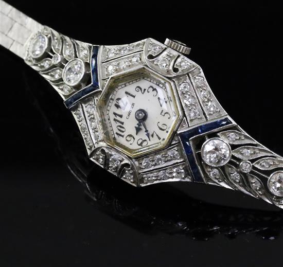 A ladys 14k white gold, sapphire and diamond set manual wind cocktail watch,